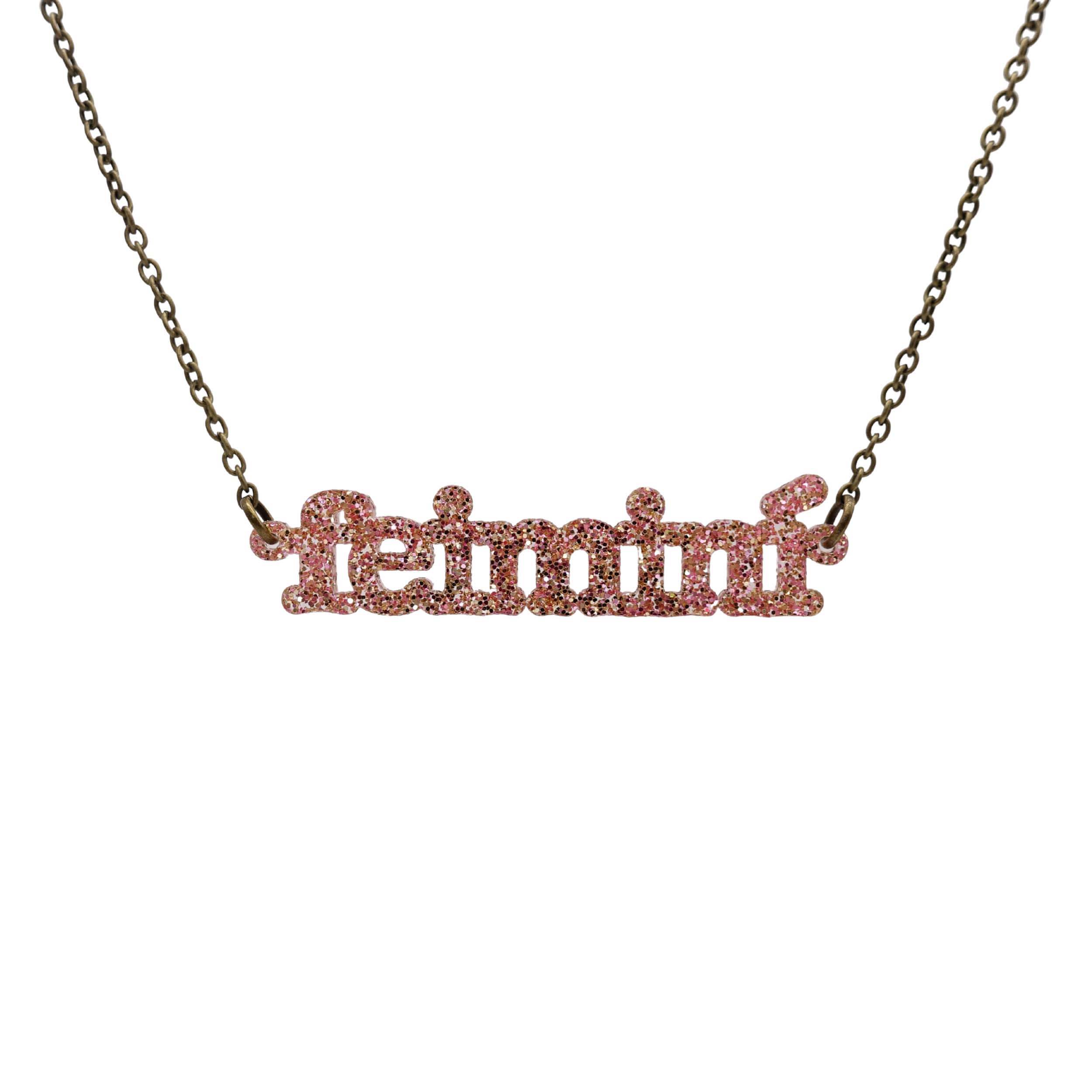Irish Gaelic Feiminí necklace in rose glitter, shown hanging against a white background.