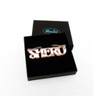 Rose gold mirror Shero necklace shown in a Wear and Resist gift box.