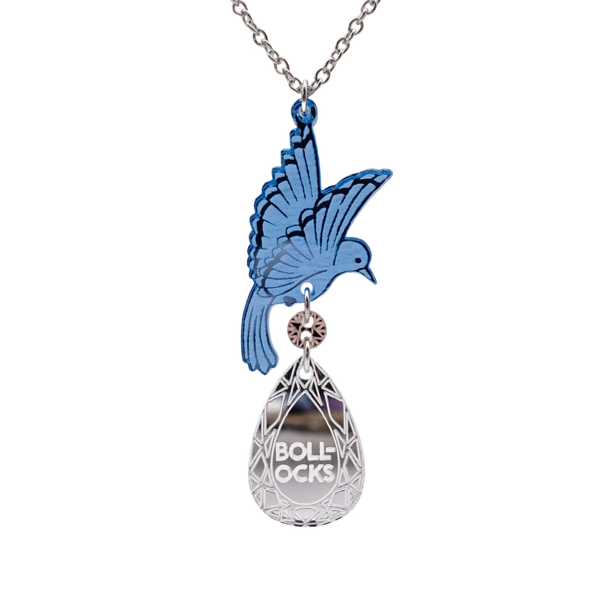 An acrylic pendant necklace with a blue bird holding a silver 'jewel' that says 'B*llocks.'