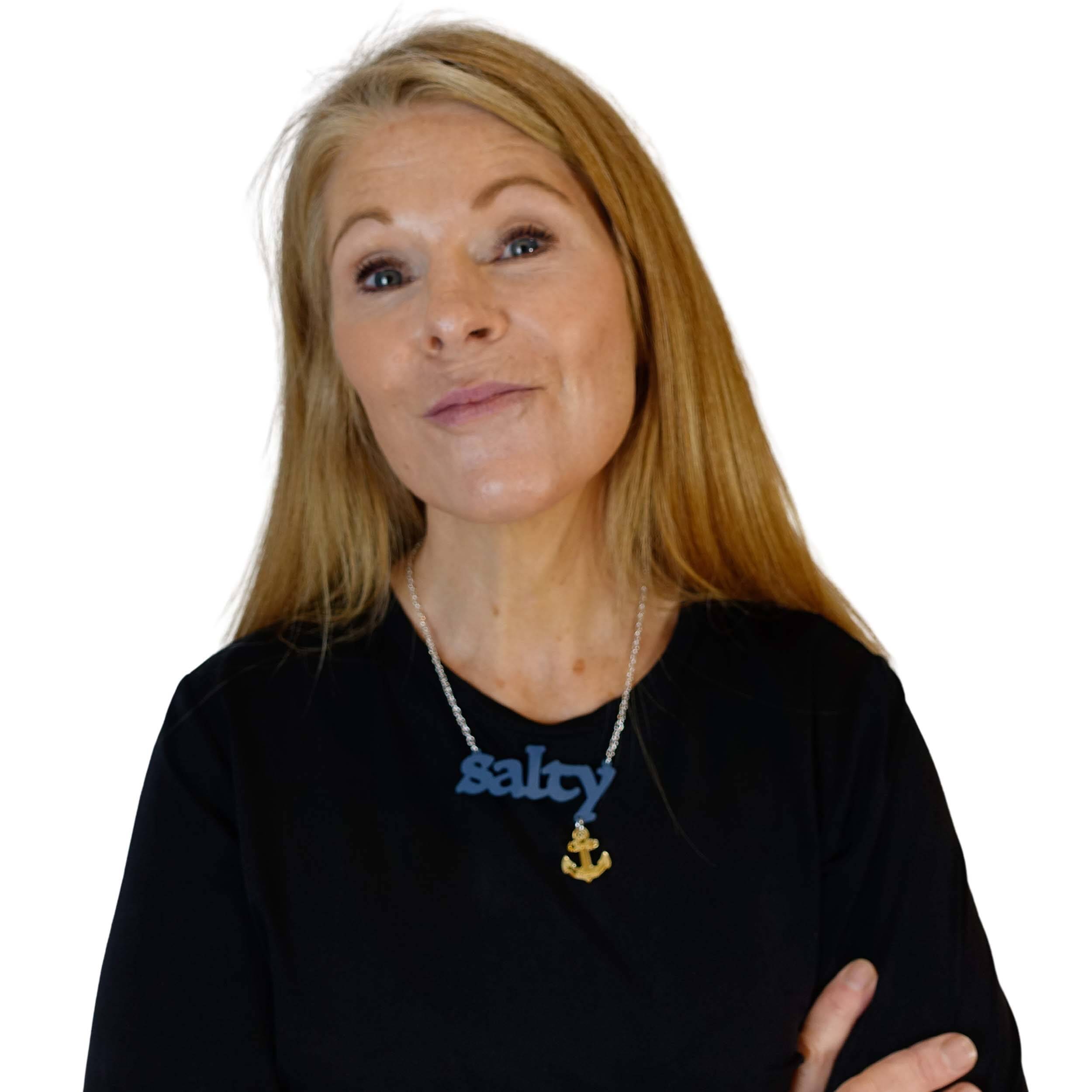 Sarah Day wears a Salty necklace with gold 'keep clear' anchor..