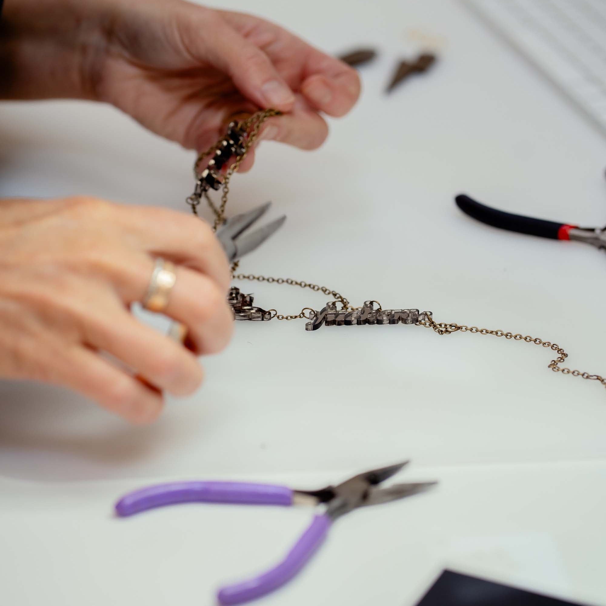 Sarah repairing jewellery.