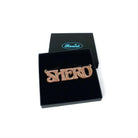 Shero necklace in pink fizz glitter shown in a Wear and Resist gift box.