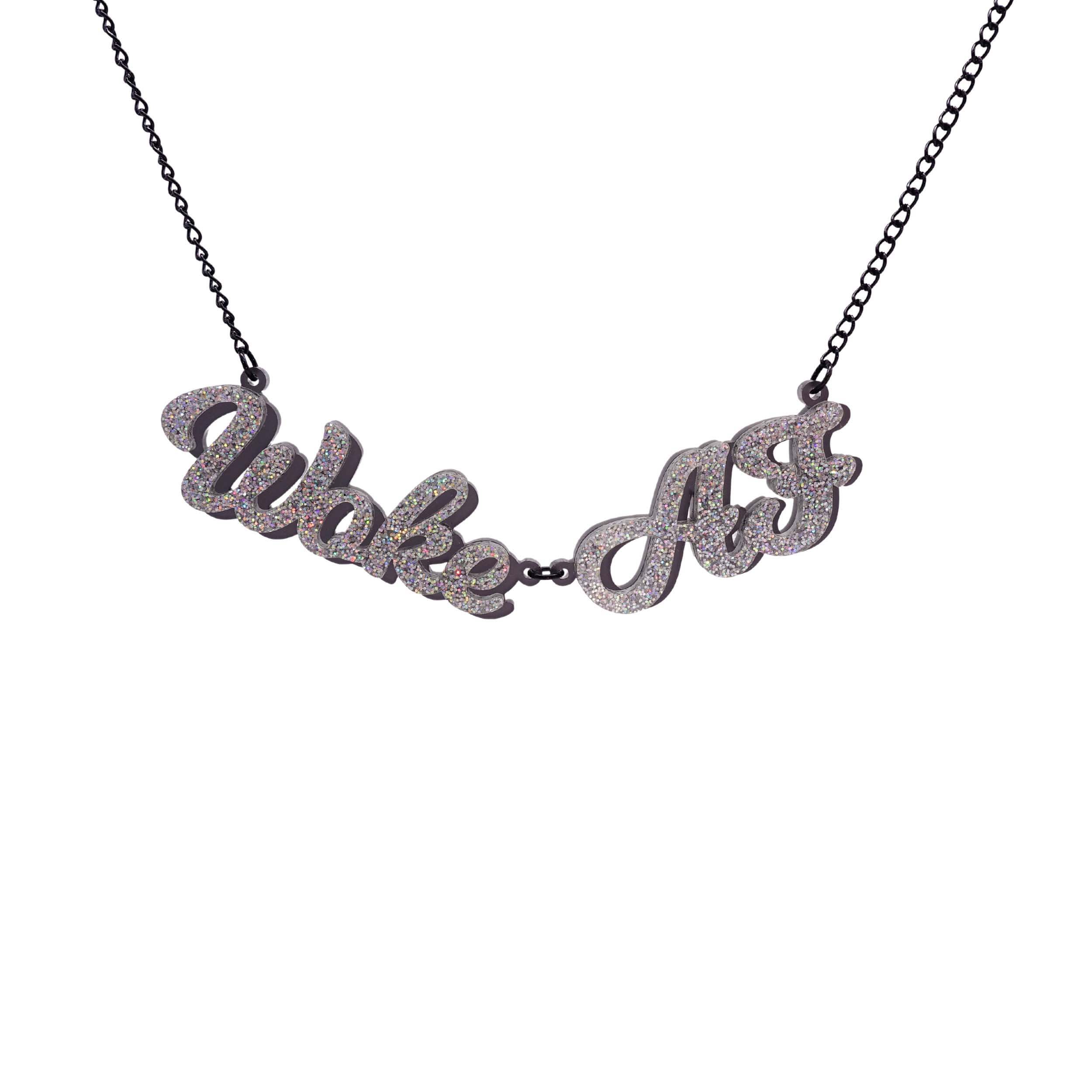 Woke AF necklace in silver glitter shown hanging against a white background.