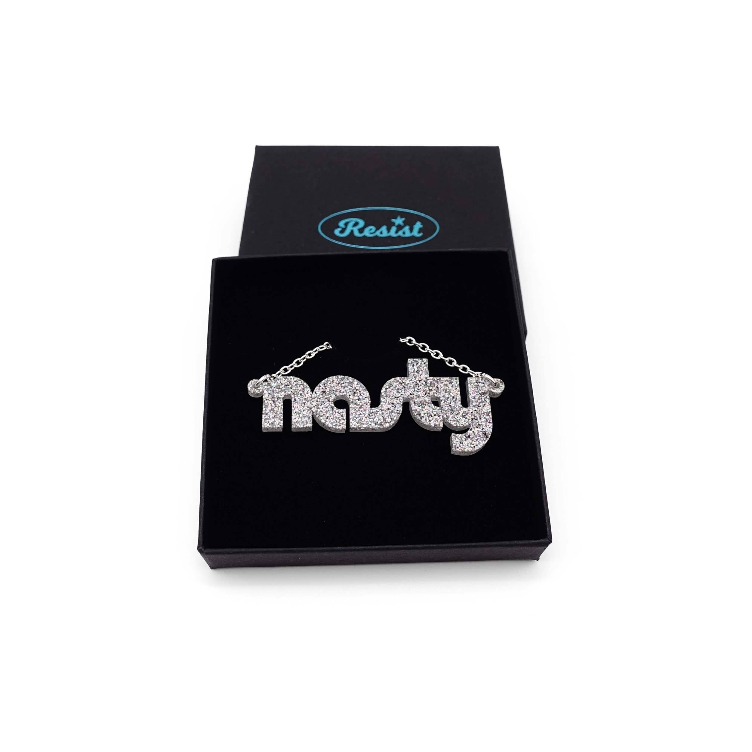 Nasty necklace in silver glitter, shown in a Wear and Resist gift box.