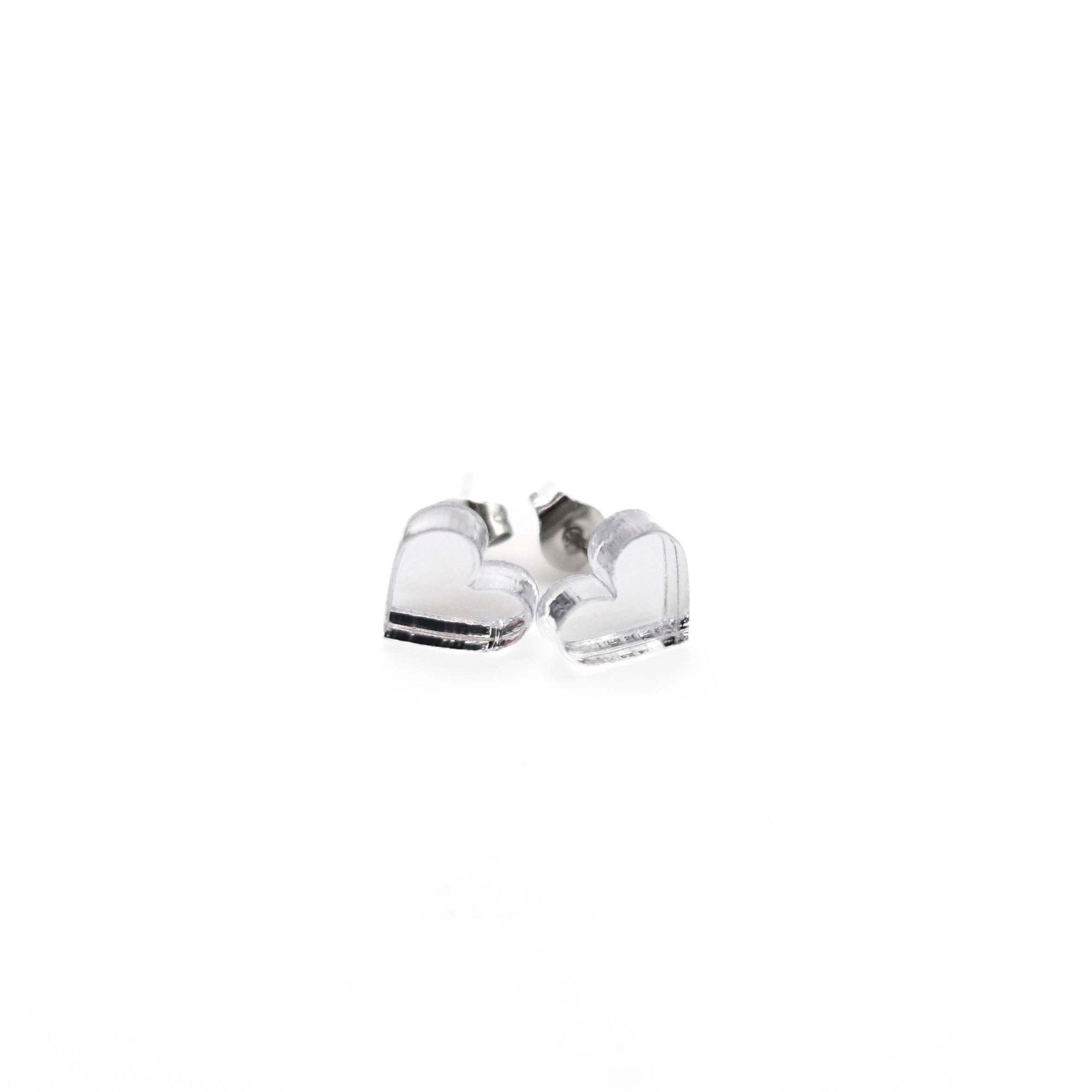 Small heart earrings in silver mirror, shown against a white background.