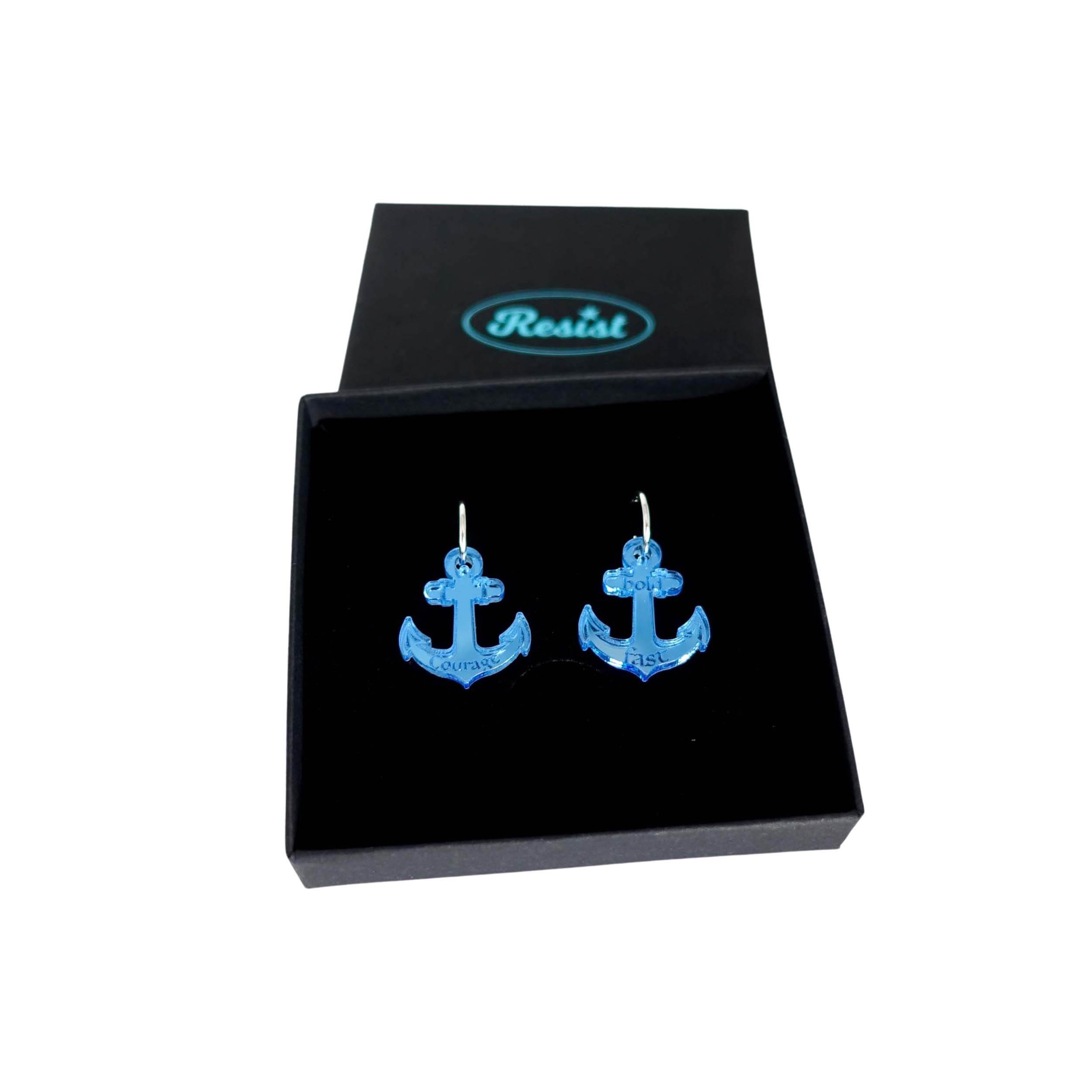 Medium anchor earrings in sky mirror etched with the words 'courage' on one and 'hold fast' on the other. Shown in a Wear and Resist gift box.