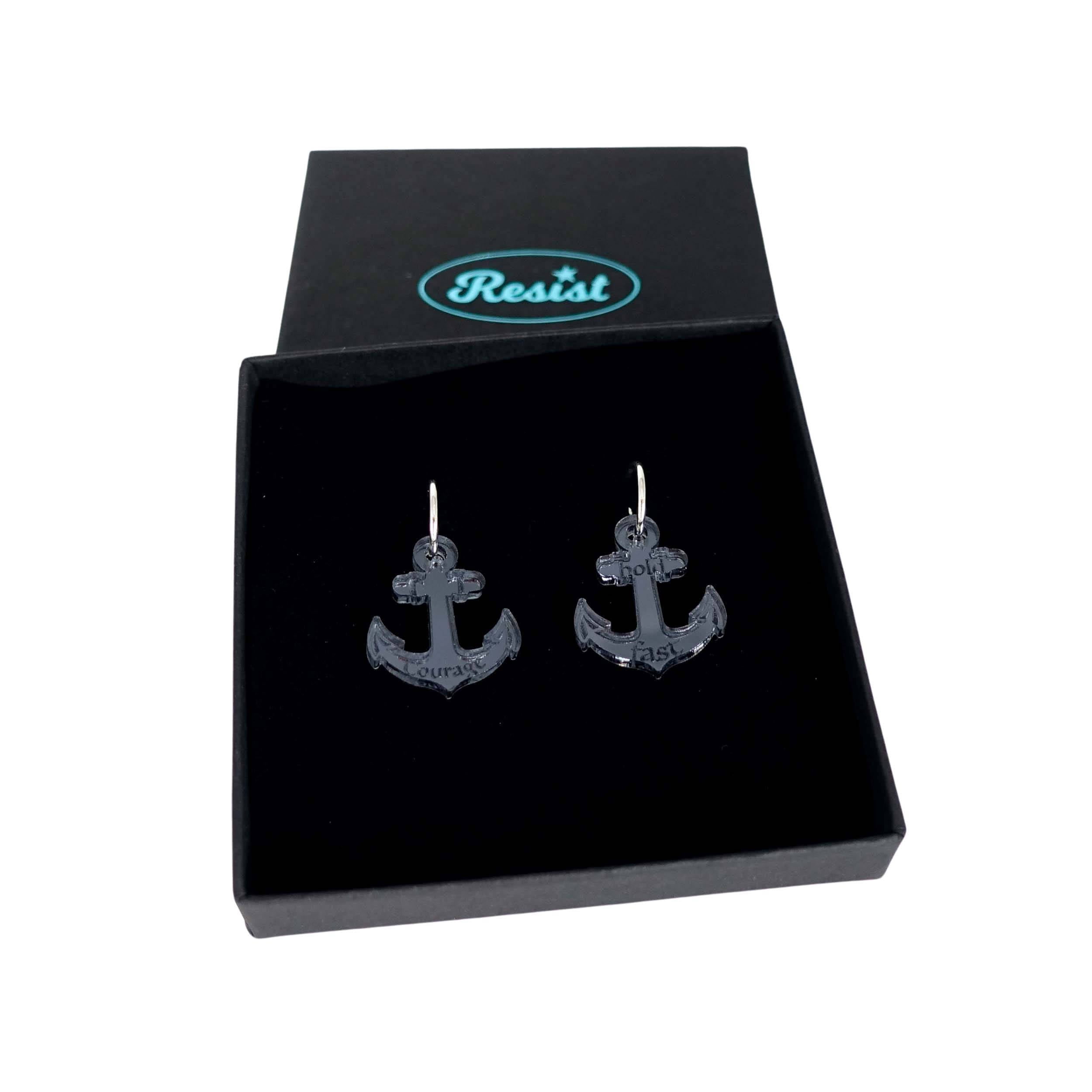 Medium anchor earrings in slate mirror etched with the words 'courage' on one and 'hold fast' on the other. Shown in a Wear and Resist gift box.
