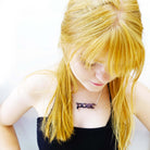 Eliza wears a slate mirror poet necklace designed by Sarah Day for Wear and Resist.