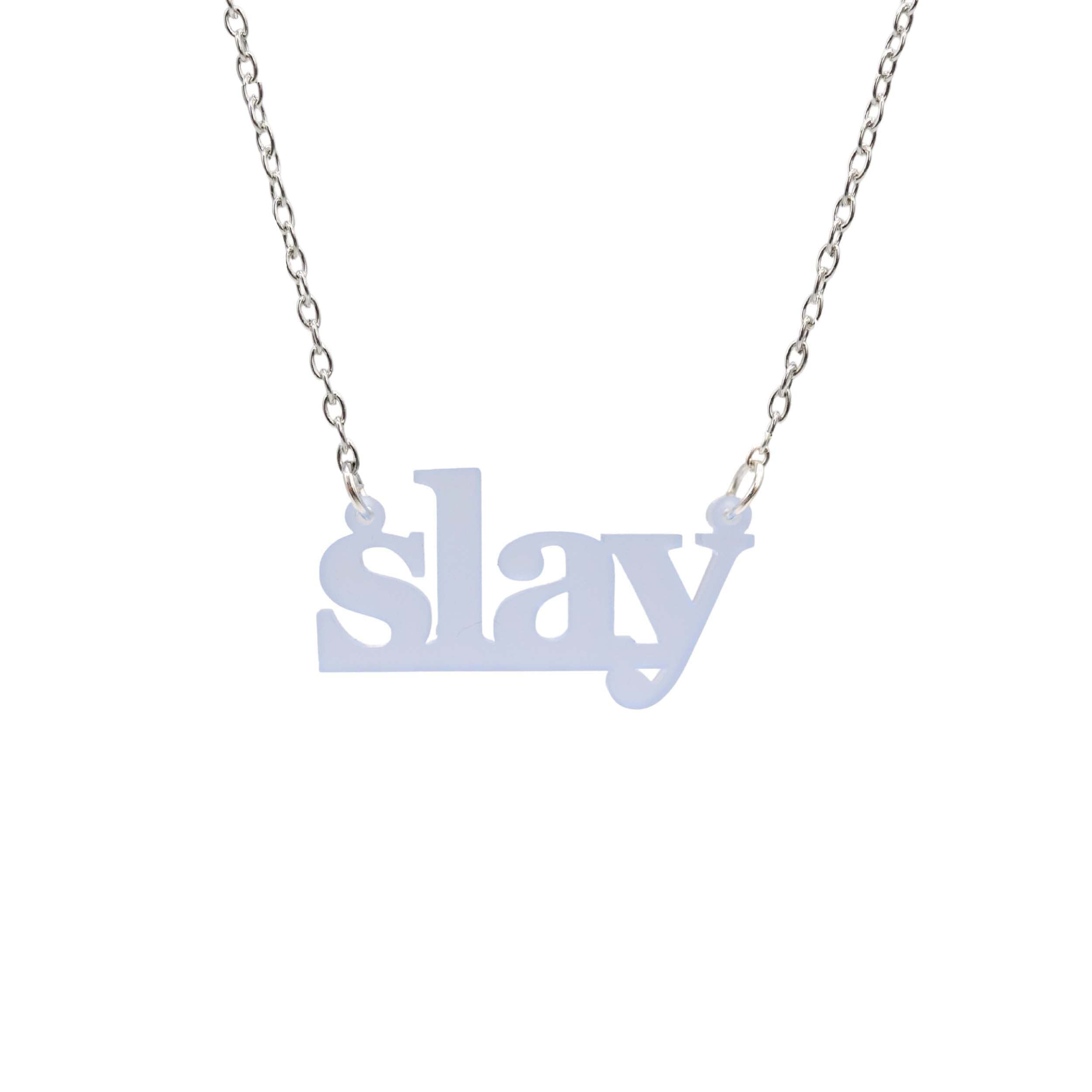 Slay necklace in sky frost on a silver chain shown hanging against a white background. Designed by Sarah Day for Wear and Resist. £2 goes to Women for Refugee Women charity.
