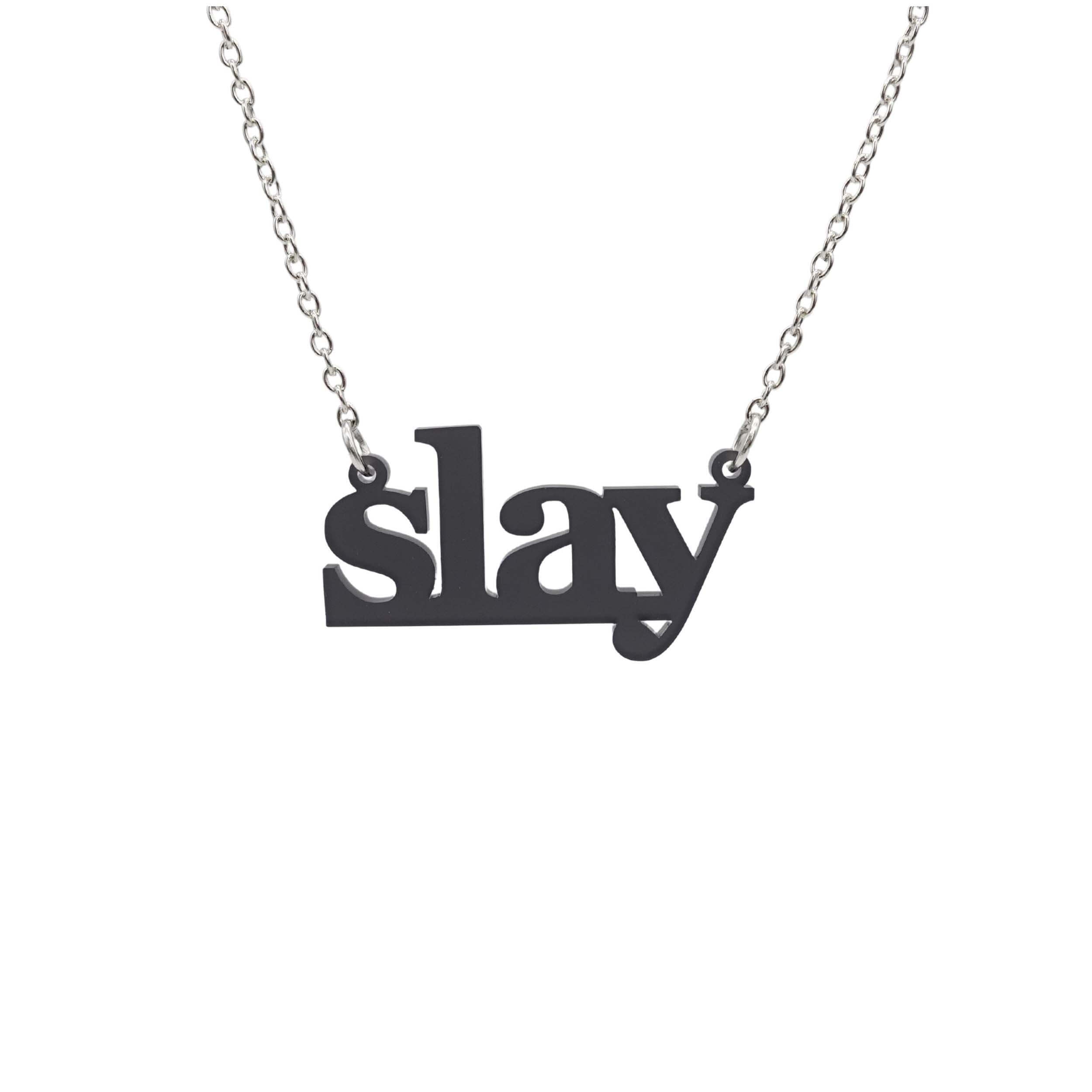 Slay necklace in slate frost on a silver chain shown hanging against a white background. Designed by Sarah Day for Wear and Resist. £2 goes to Women for Refugee Women charity.