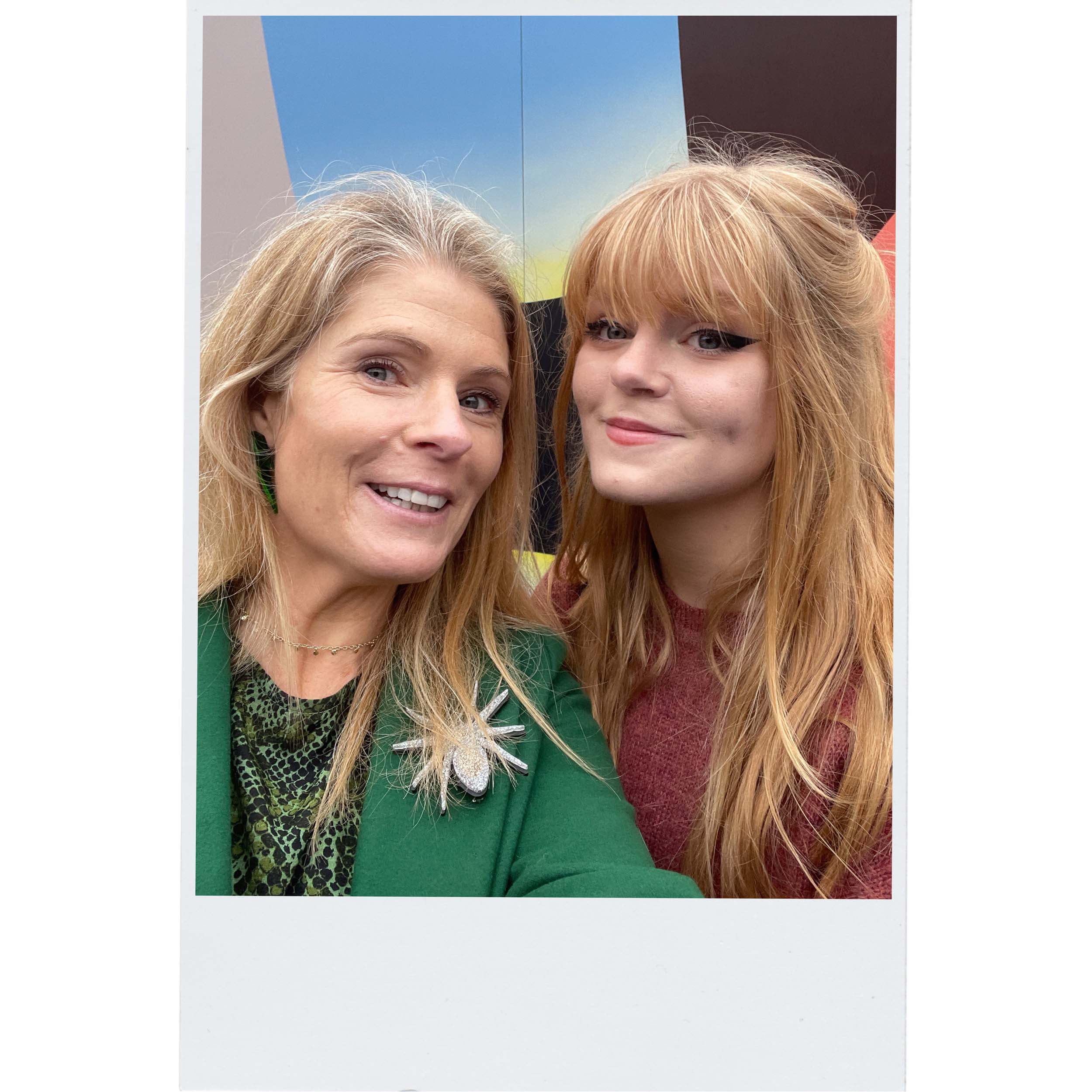 Sarah Day, founder of Wear and Resist, wears the All Hail Lady Hail Spider brooch, with her daughter Eliza.
