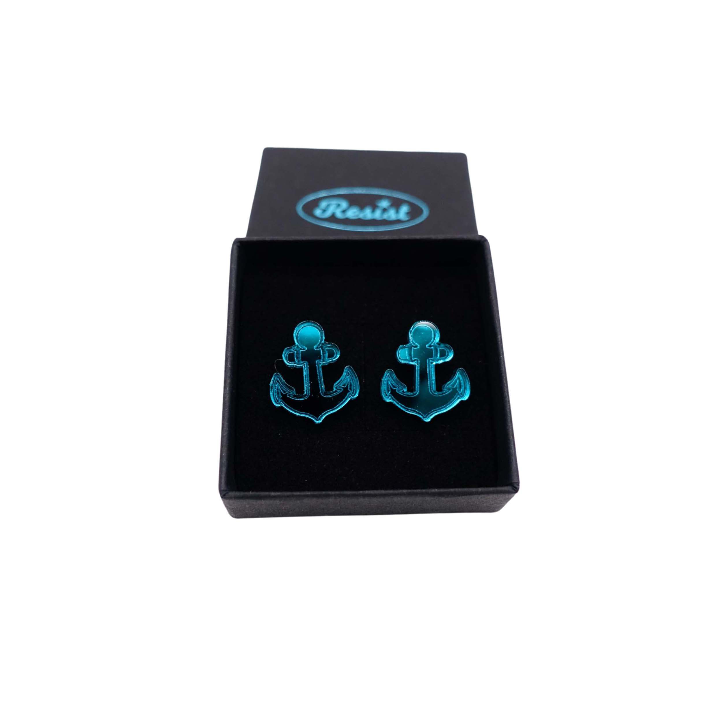 Teal mirror little anchor earrings shown in a Wear and Resist gift box.
