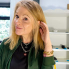 Sarah wears the choker and necklace length in stainless steel and the choker in gold plated worn twice around her wrist, with Persist, Hold Fast and F*ck Yeah glow-in-the-dark charms.