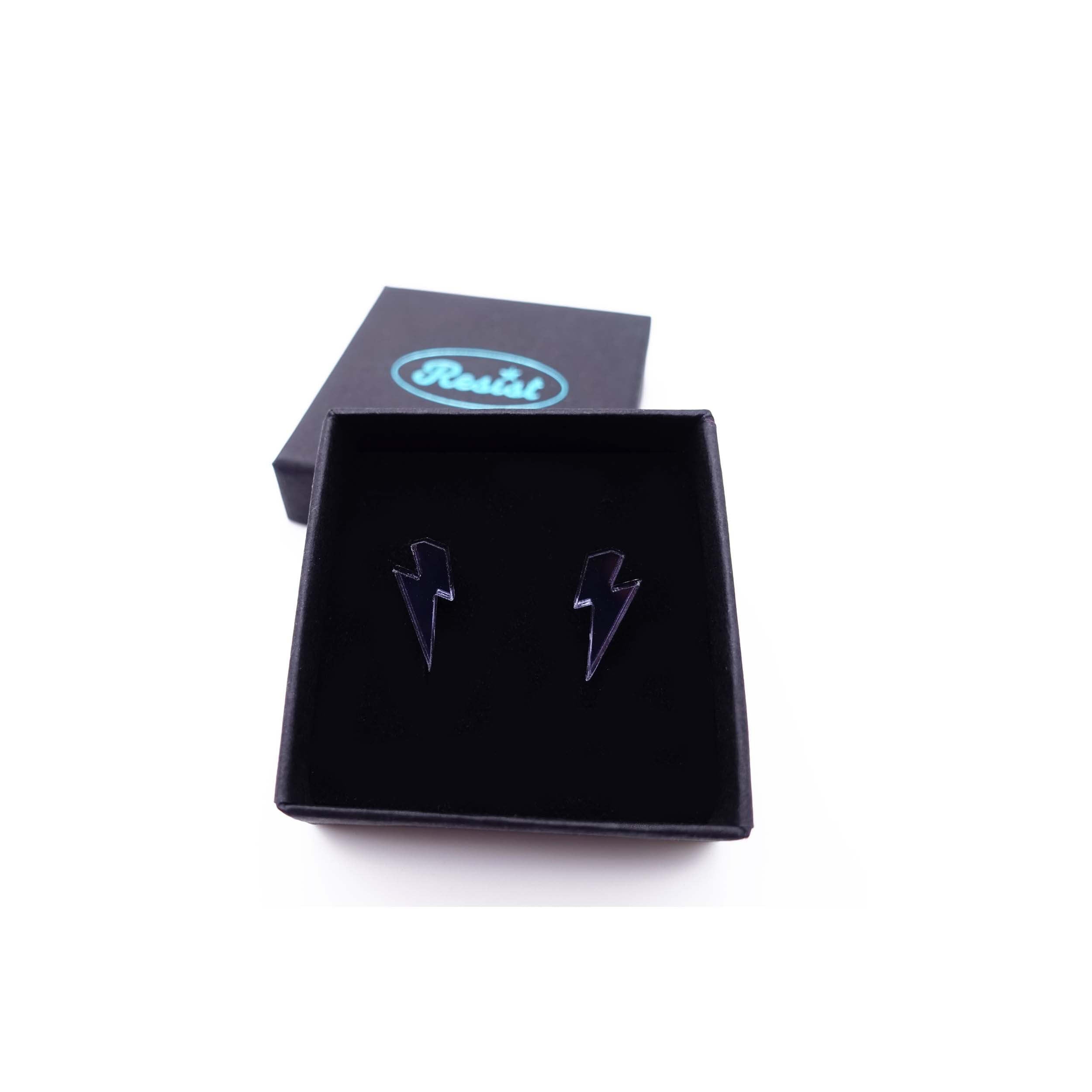 Tiny Lightning Bolt earrings in slate mirror, shown in a small Wear and Resist gift box.
