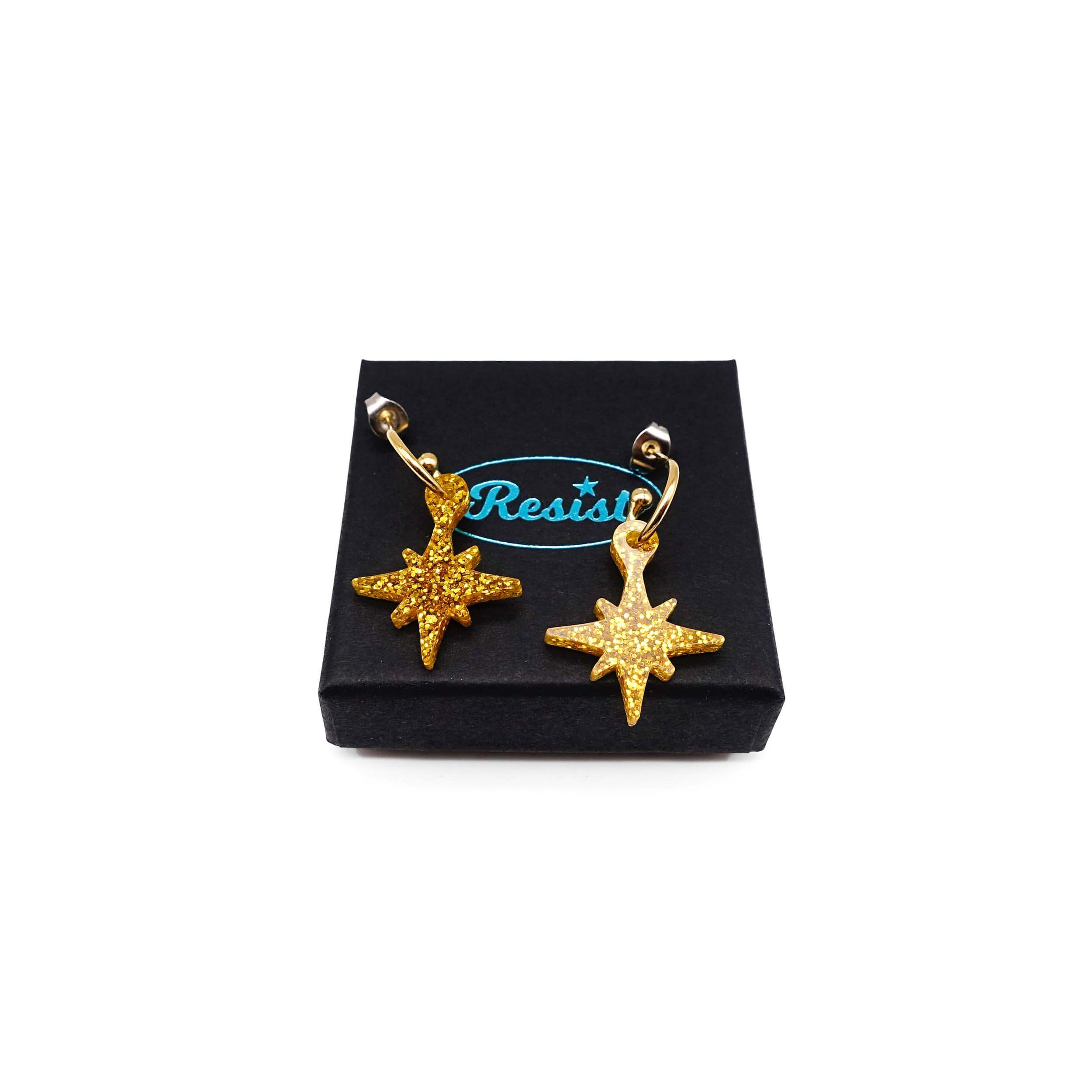 Ultra gold glitter limited edition Festive Vintage Star earrings, shown on a Wear and Resist gift box.