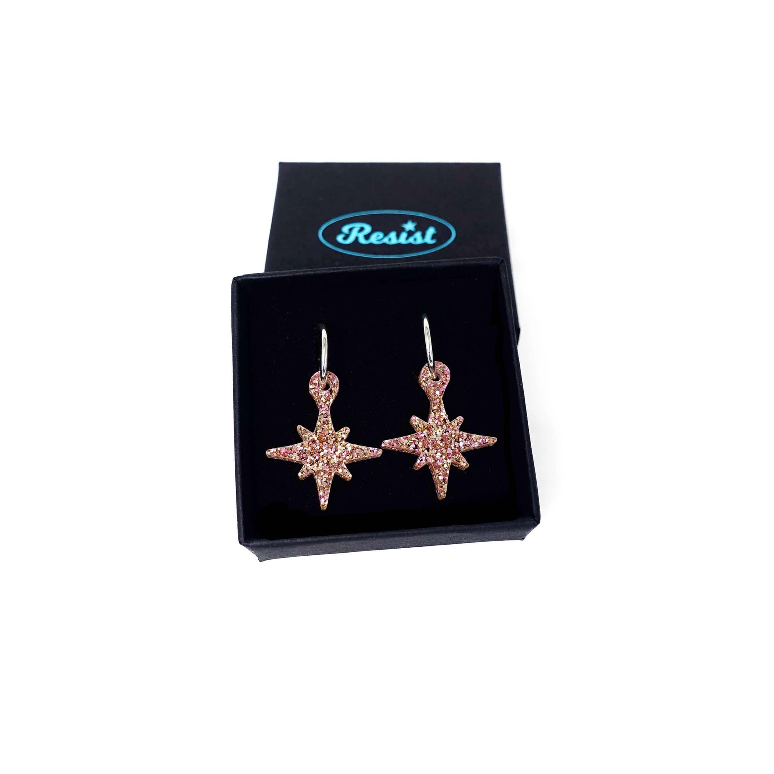 Vintage star earrings in pink fizz glitter shown in a Wear and Resist gift box.