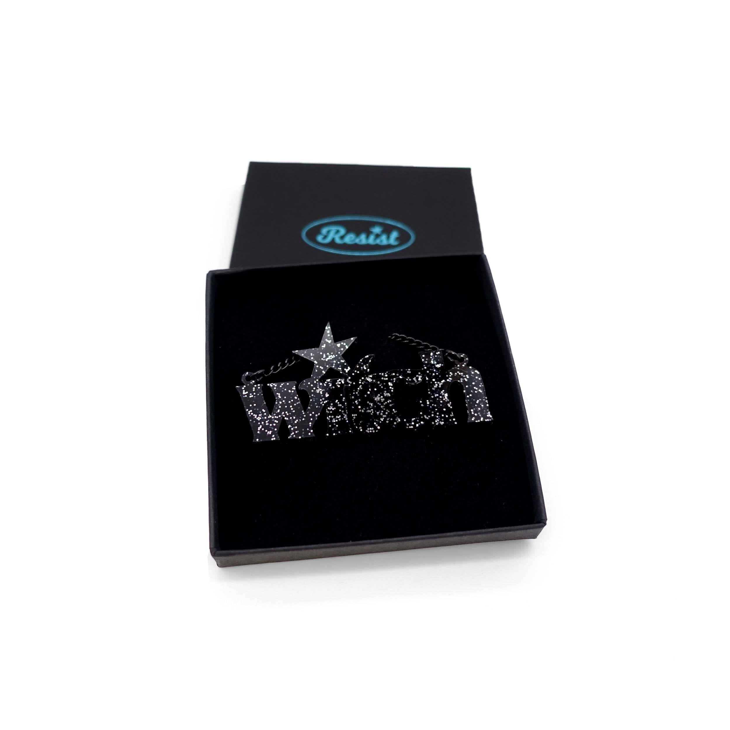 Black glitter Witch necklace in a Wear and Resist gift box.