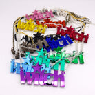 All of the Witch necklaces shown strewn together on a white background.