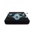 Bracelet inscribed with 'Be brave, it's supposed to be hard,' designed by Sarah Day for Wear and Resist, shown sitting on a Wear and Resist gift box.