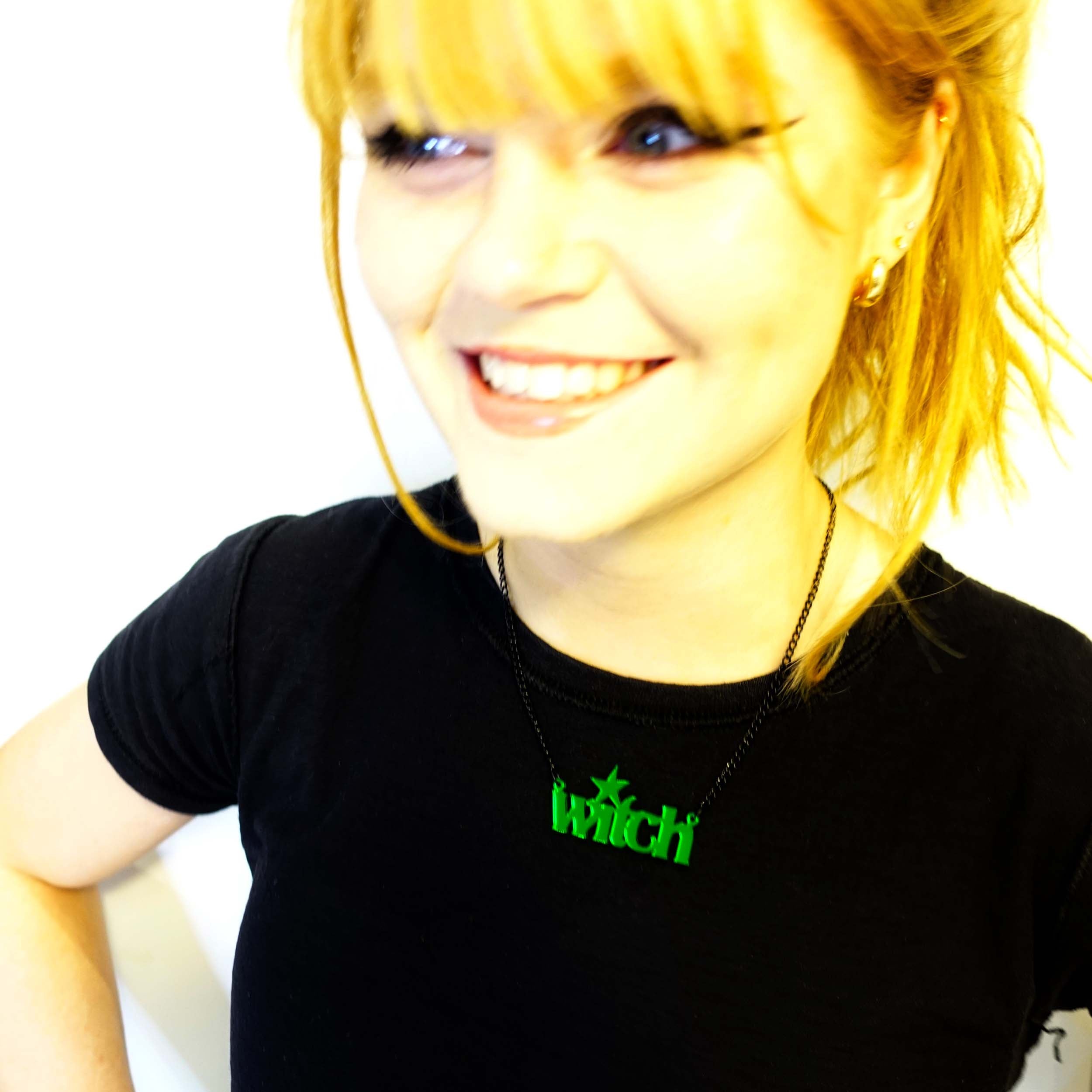 Eliza wears an envy green mirror witch necklace. We are the great grand-daughters of the witches they tried to burn!