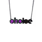Black glitter and purple mirror Pro-choice necklace, shown hanging on black chain, designed by Sarah Day for Wear and Resist. £2 goes to Alliance for Choice who campaign  for Free, Safe and Legal abortions for anyone who needs them.
