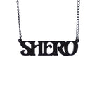 Matte black Shero necklace hanging against a white background.