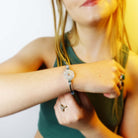 Eliza wears Wear and Resist's Be Brave bracelet.