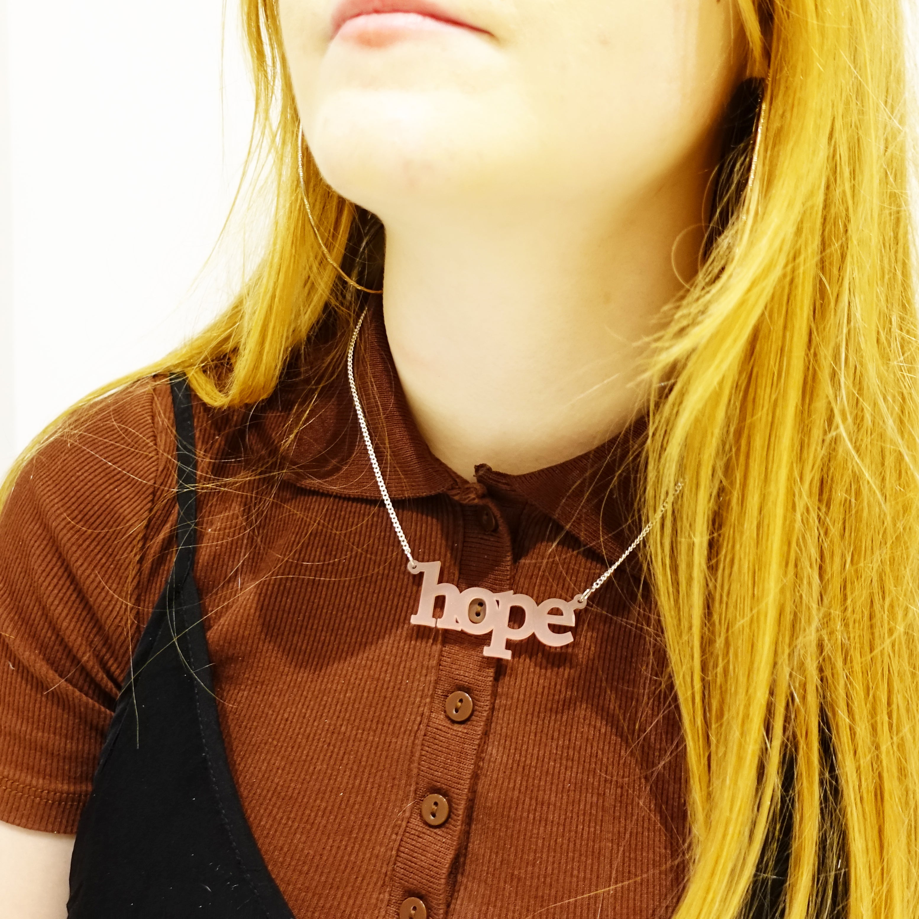 Eliza wears blush frost Hope necklace. Give someone the gift of hope.