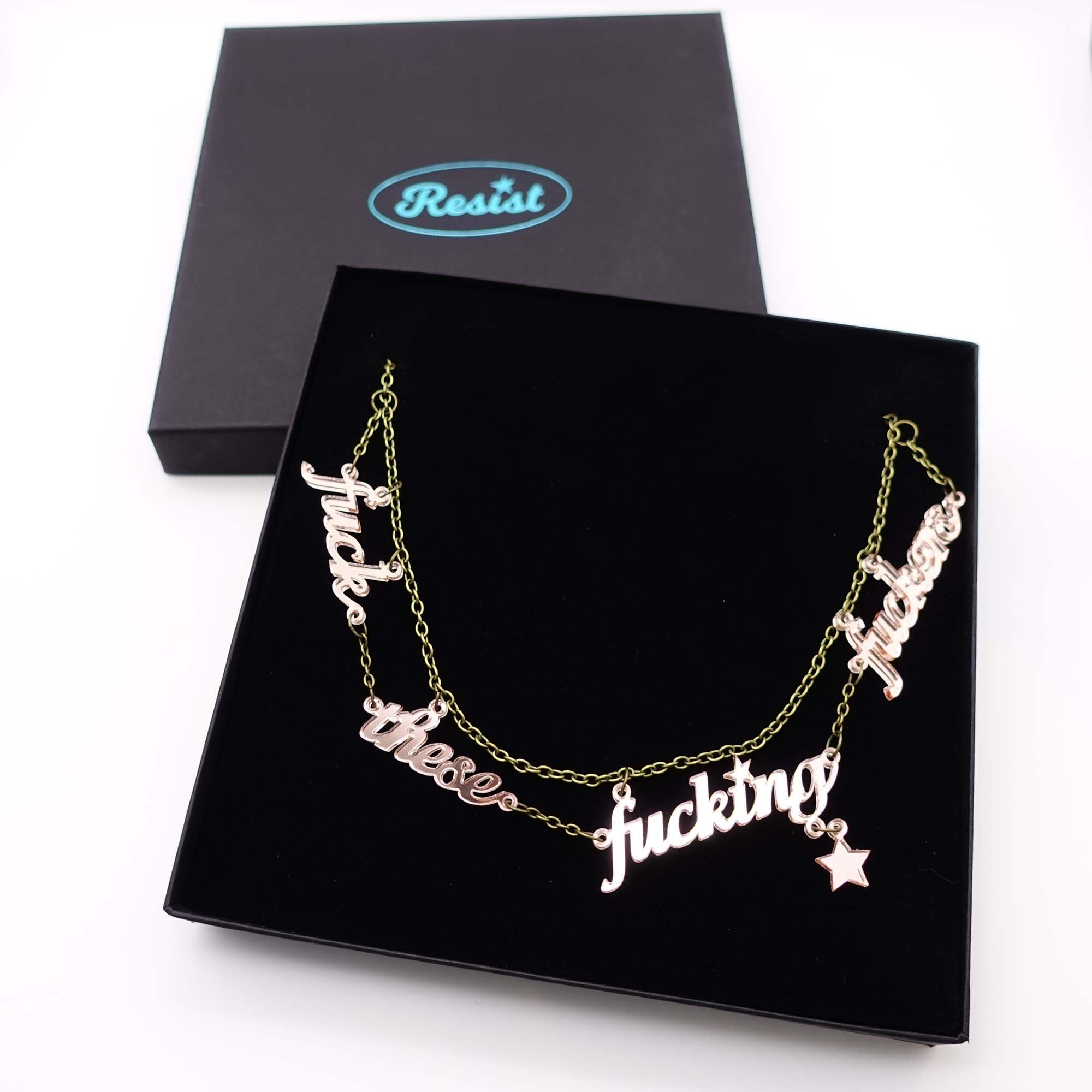 F*ck these F*cking F*ckers necklace in rose gold mirror, shown in large Wear and Resist gift box.