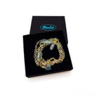 The Have a Word with Yourself design on a gold-plated paperclip chain, with the words 'I love me' and 'shero etched in glow-in-the-dark pigment and finished with a heart charm. Shown in a Wear and Resist gift box.
