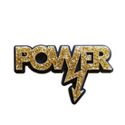 gold glitter Mary Beard power brooch