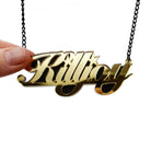 Gold mirror feminist KILLJOY necklace shown hanging against a white background.