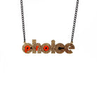 Gold glitter and flame mirror Pro-choice necklace, shown hanging on black necklace, designed by Sarah Day for Wear and Resist. £2 goes to Alliance for Choice who campaign  for Free, Safe and Legal abortions for anyone who needs them.
