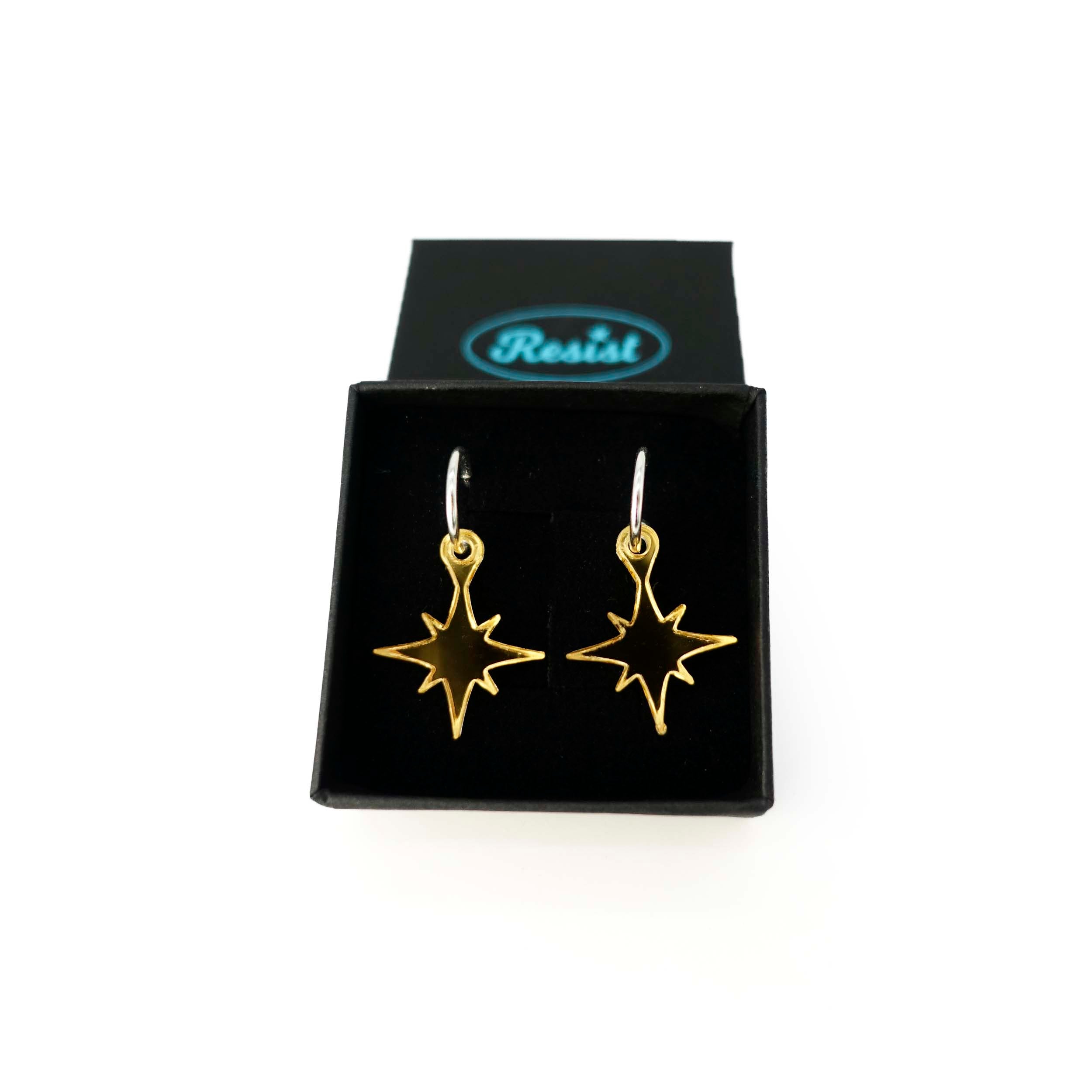 Gold mirror vintage star earrings shown in a Wear and Resist gift box.