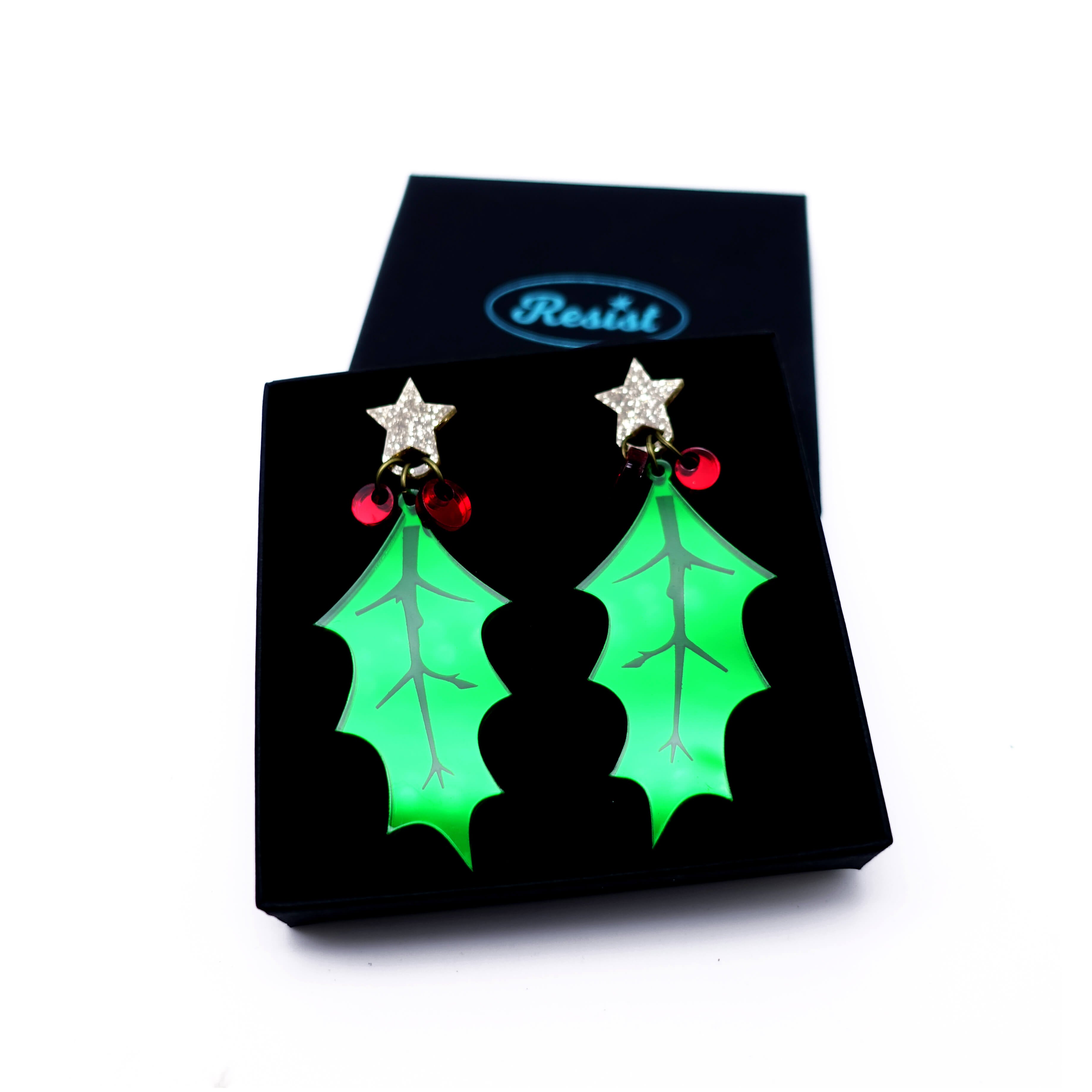 Statement Holly and berries earrings with gold glitter star fixings, shown in a Wear and Resist gift box.