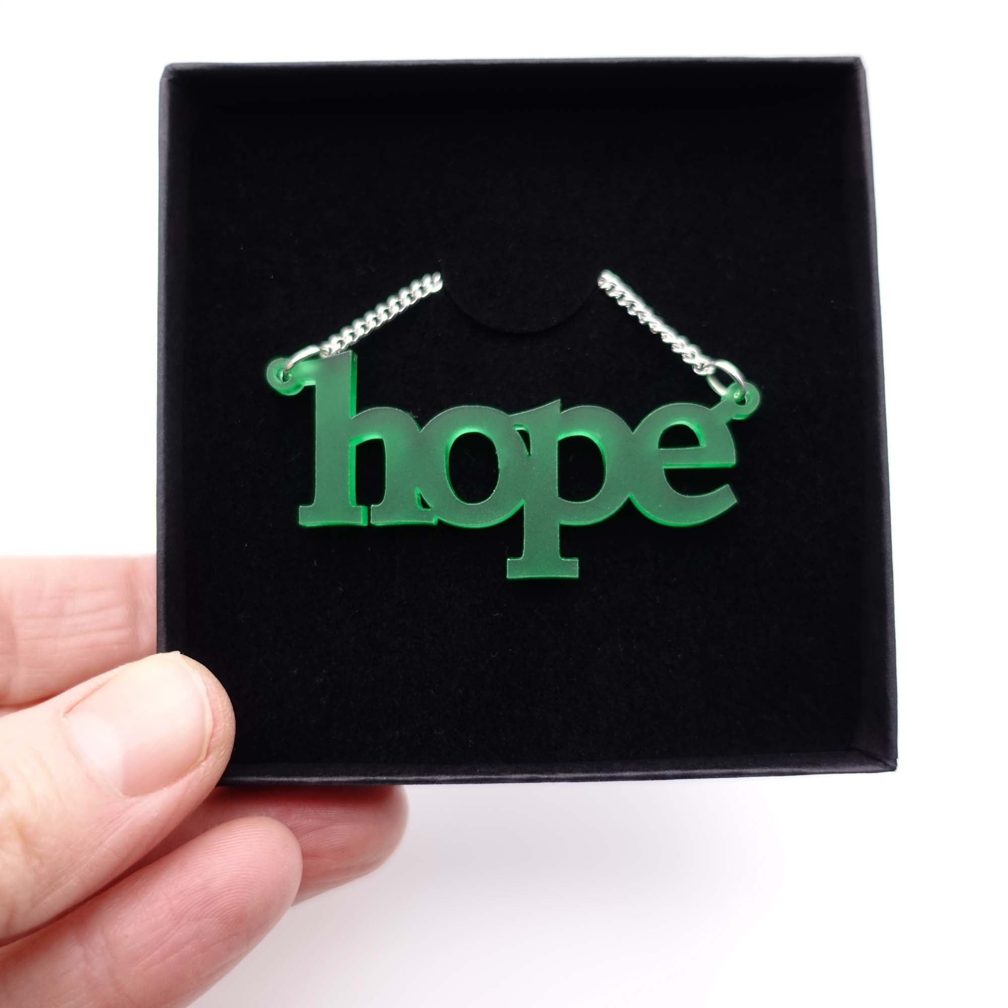 Leaf frost Hope necklace shown in a Wear and Resist gift box.