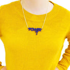 Model wears an indig frost mini power necklace designed in collaboration with Mary Beard.