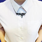 Model wears a mini power necklace in matte black.