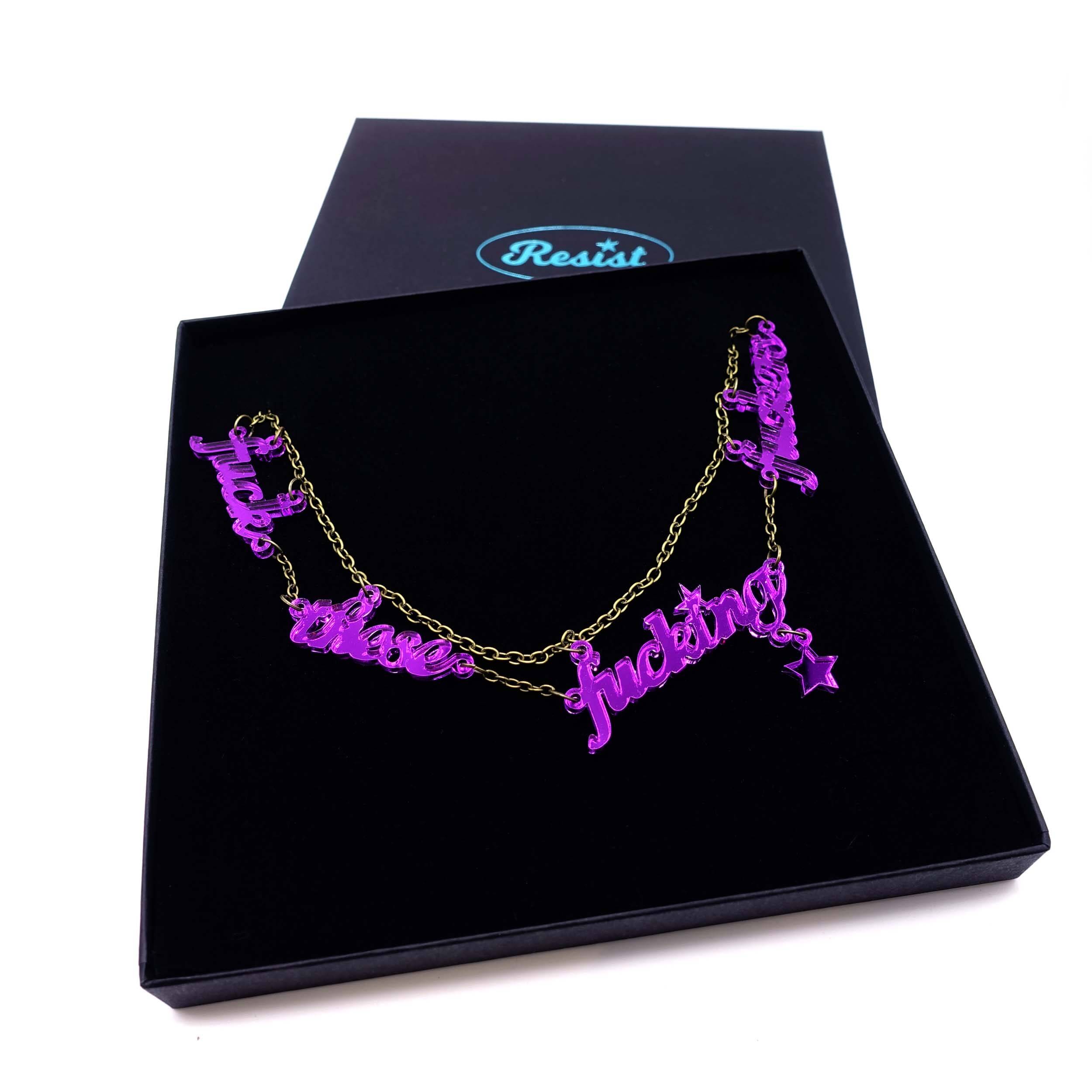 F*ck these F*cking F*ckers   necklace in purple mirror, shown in large Wear and Resist gift box.