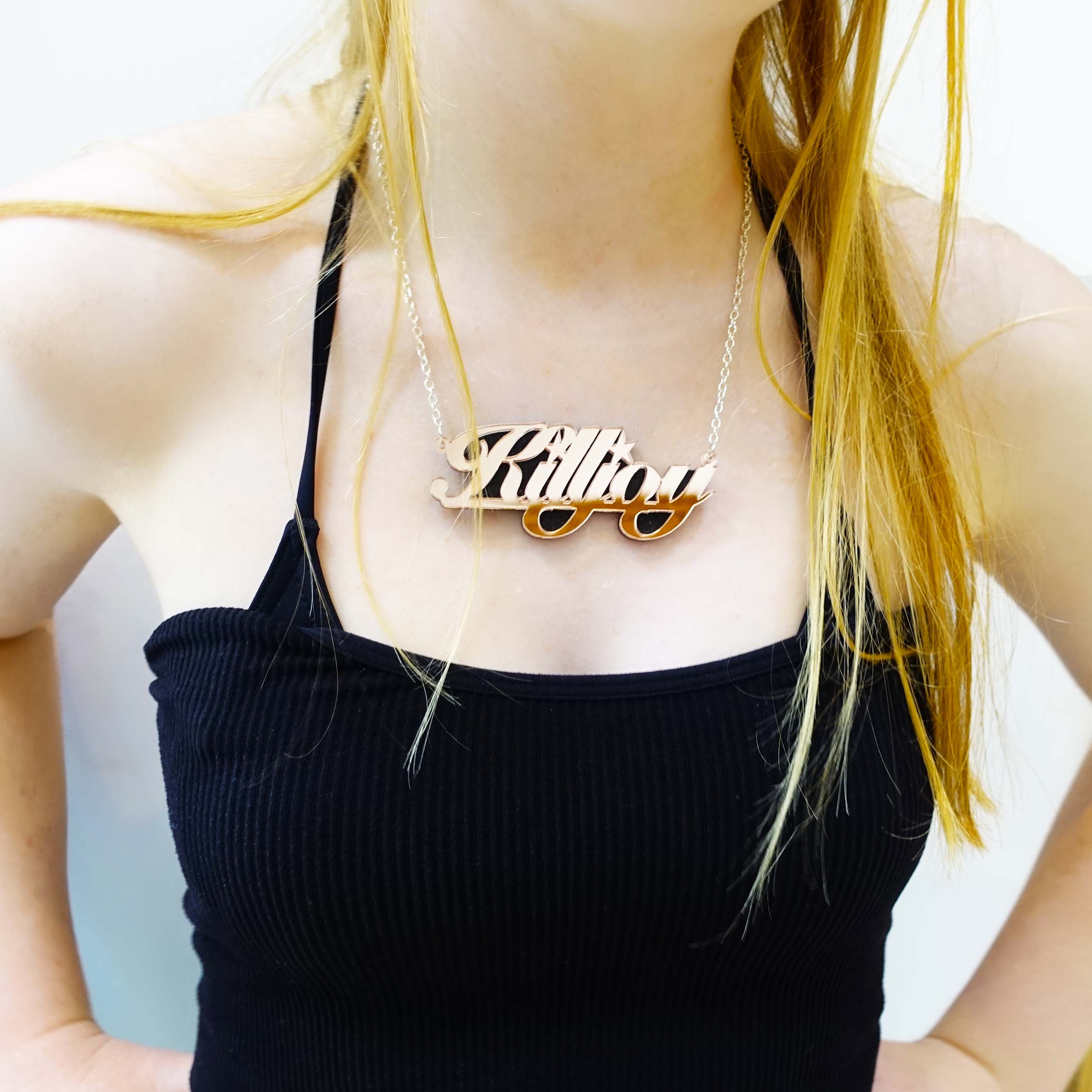 Eliza wears rose gold feminist KILLJOY necklace
