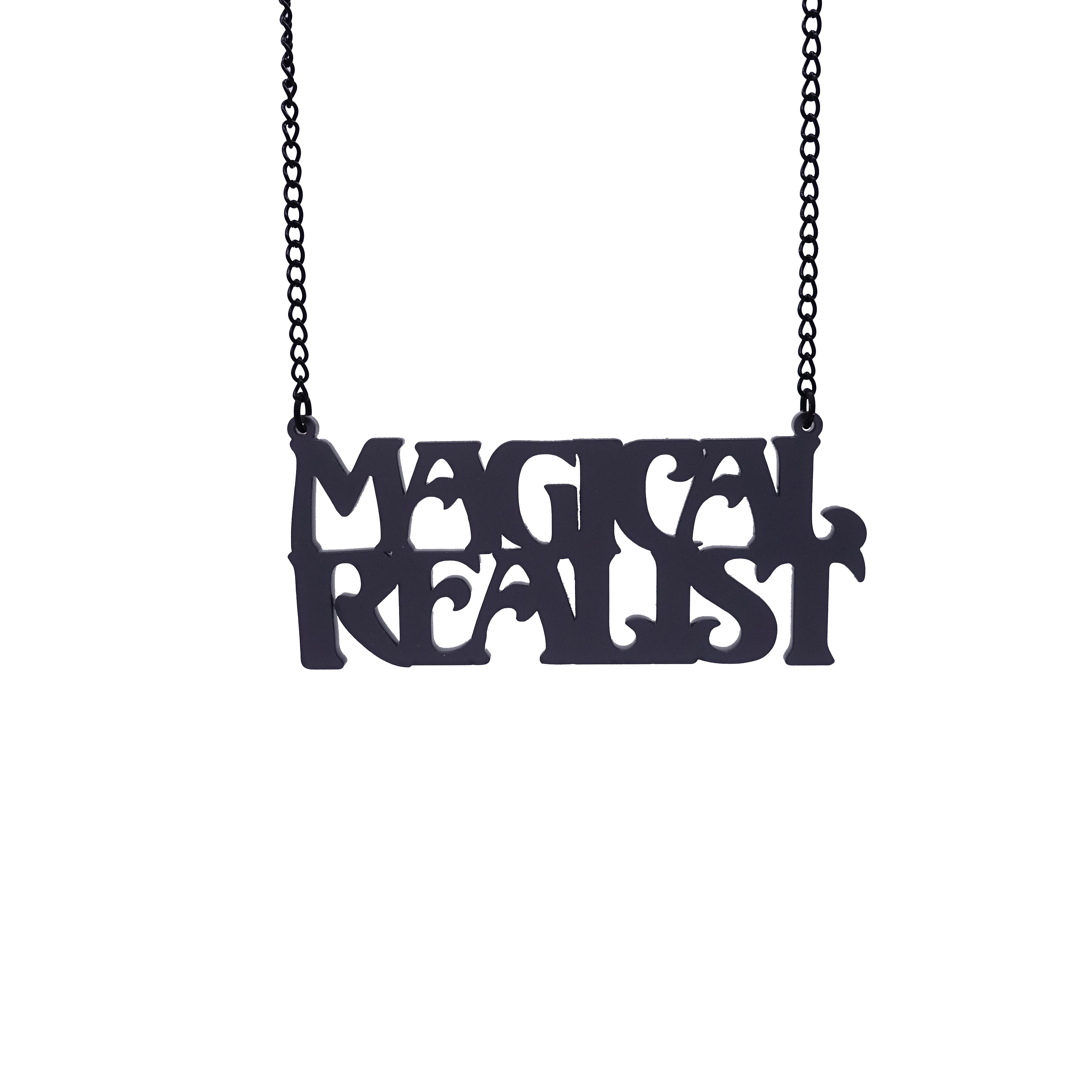 A slate frost Magical Realist necklace, shown hanging against a white background.