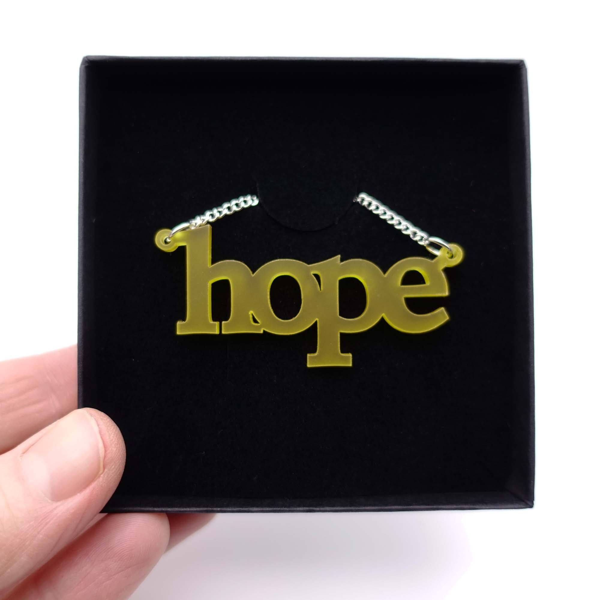 Sunflower frost Hope necklace shown in a Wear and Resist gift box.