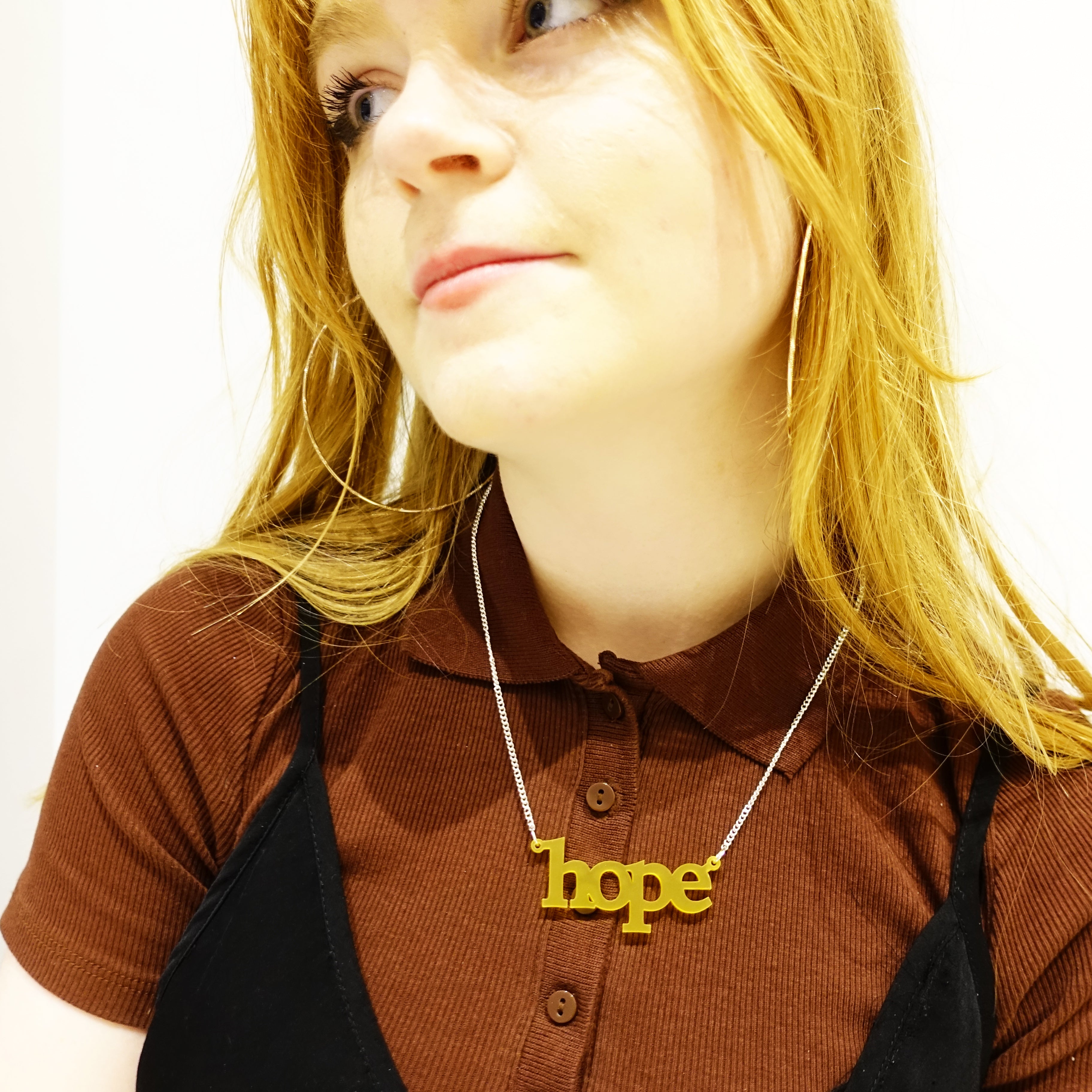 Eliza wears a sunflower frost Hope necklace.