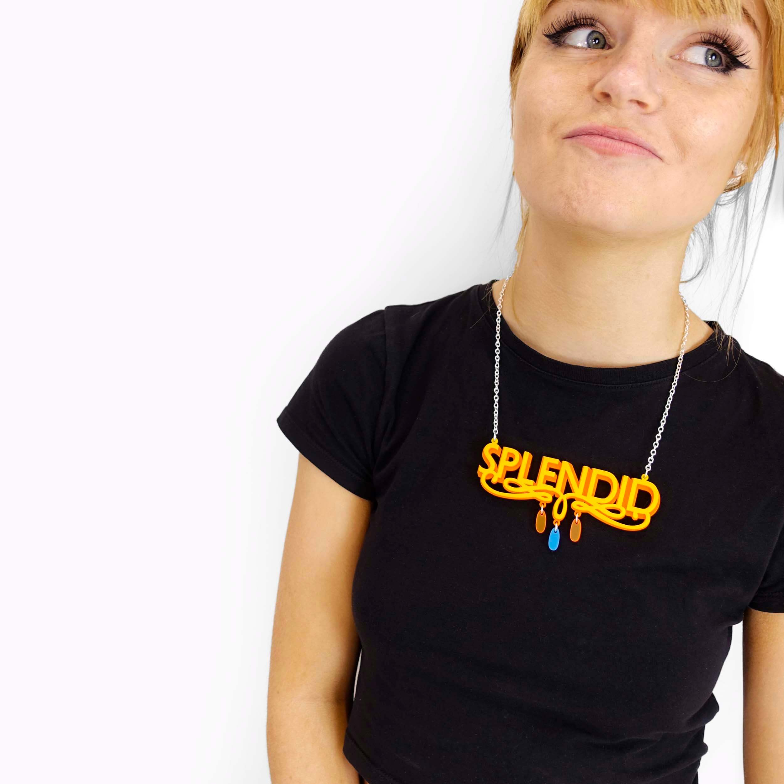 Eliza wears a sunflower yellow and orange Splendid necklace.