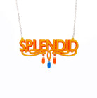 Sunflower yellow and orange Splendid necklace shown hanging against a white background.