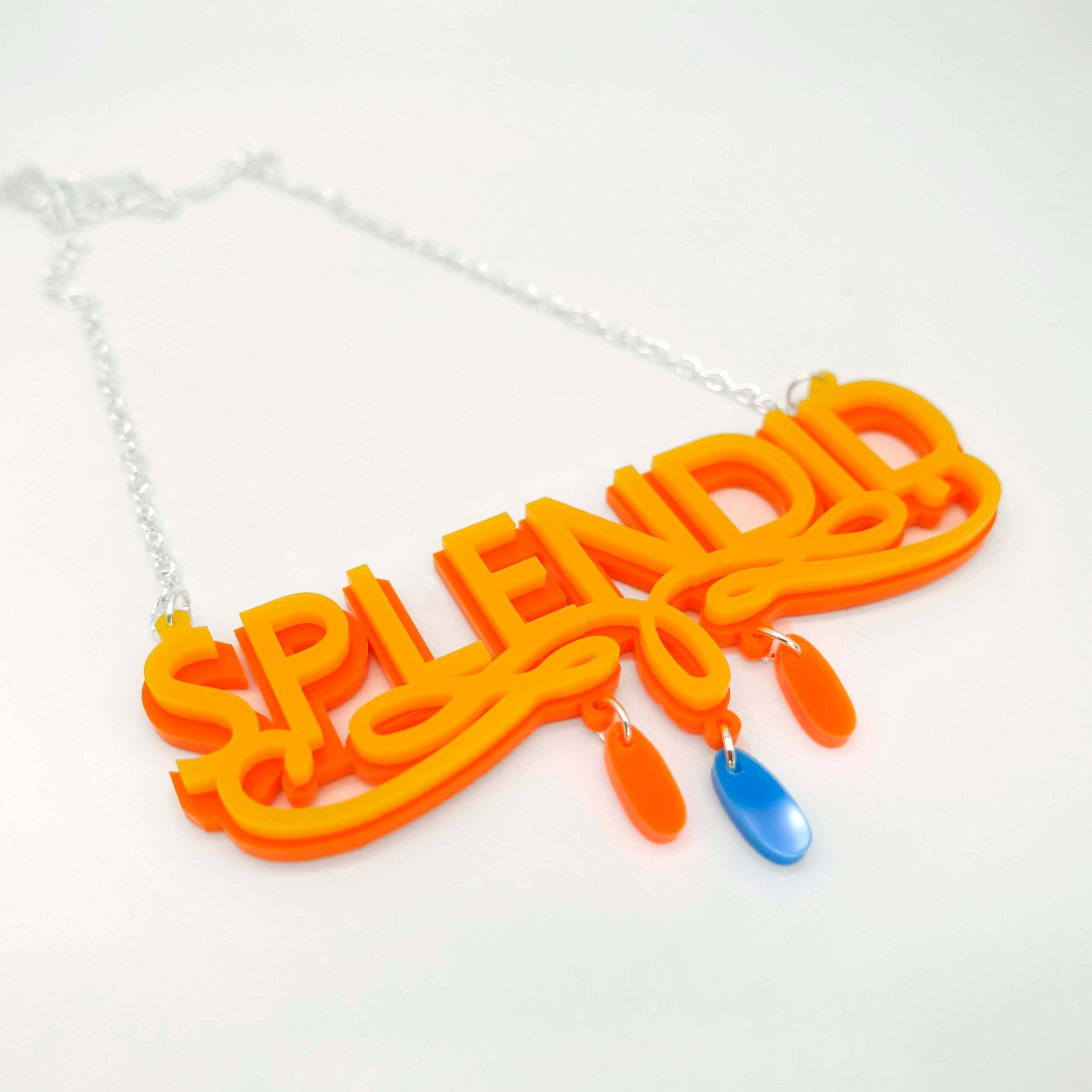 Splendid necklace in sunflower yellow and orange, shown on a white surface.