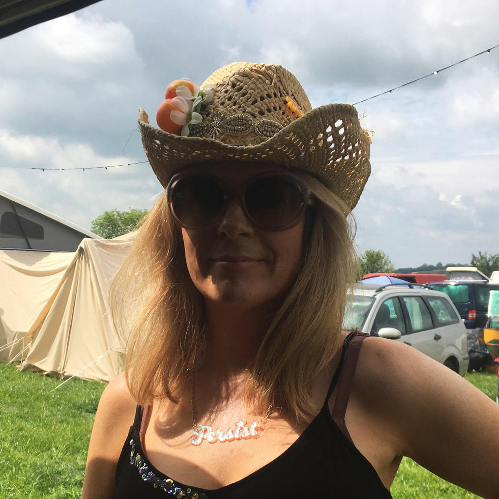 Sarah Day, Founder of Wear and Resist wears a Persist necklace. 