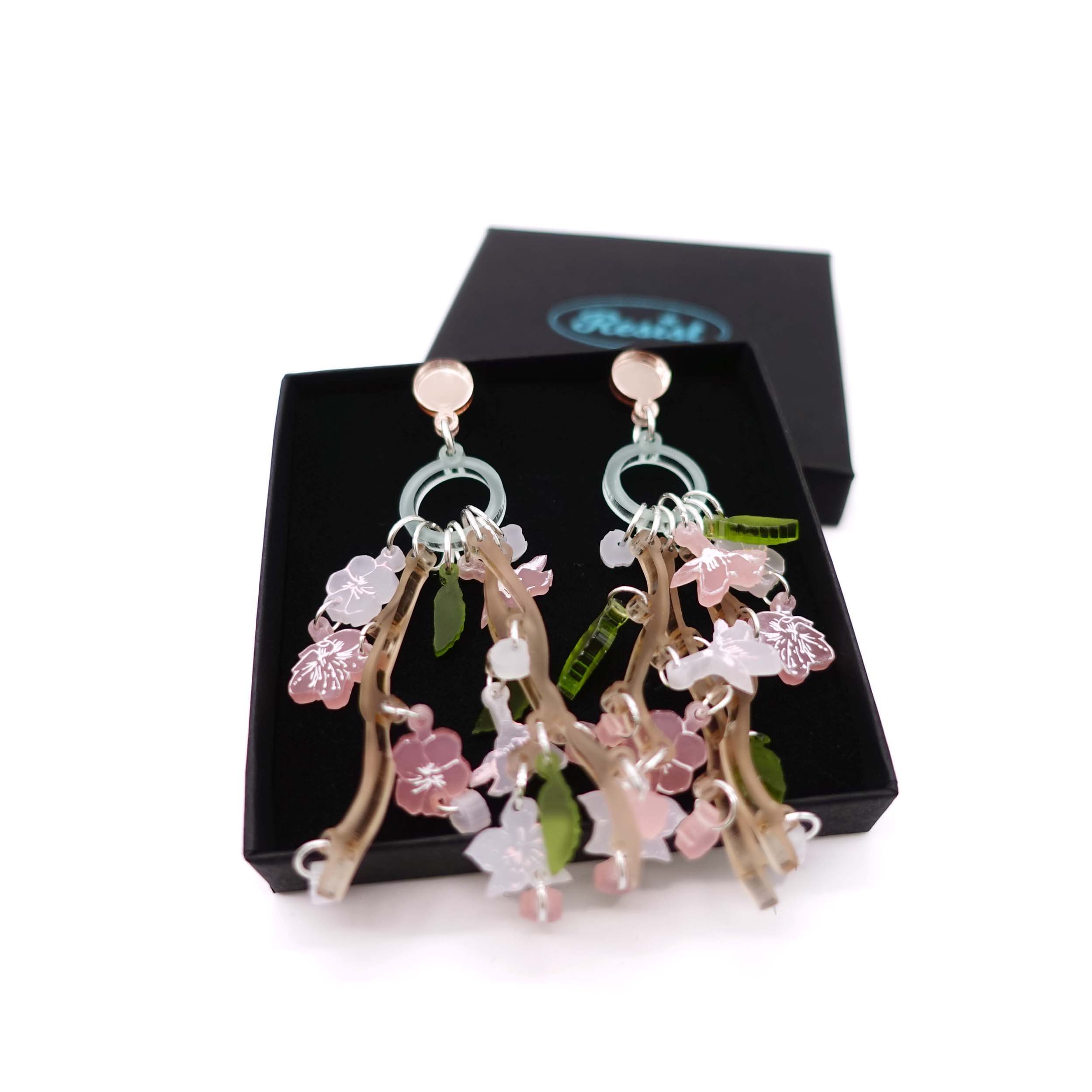 Limited edition cherry blossom earrings designed by Sarah Day shown in a Wear and Resist gift box. 