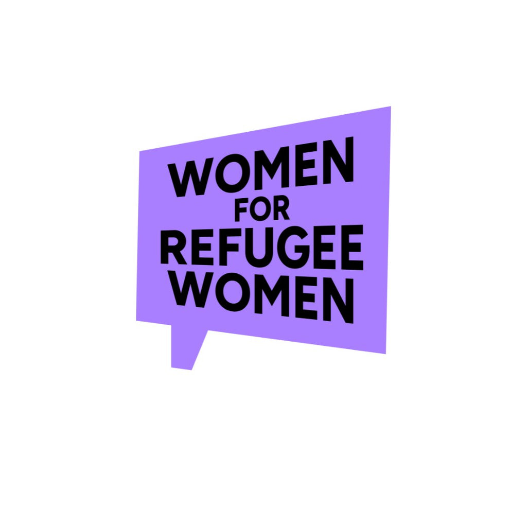 Model wears Courage and Hold Fast earrings designed by Sarah Day for Wear and Resist in front of a Women for Refugee Women logo. £2 from everything in The Courage Collection goes to Women for Refugee Women. 