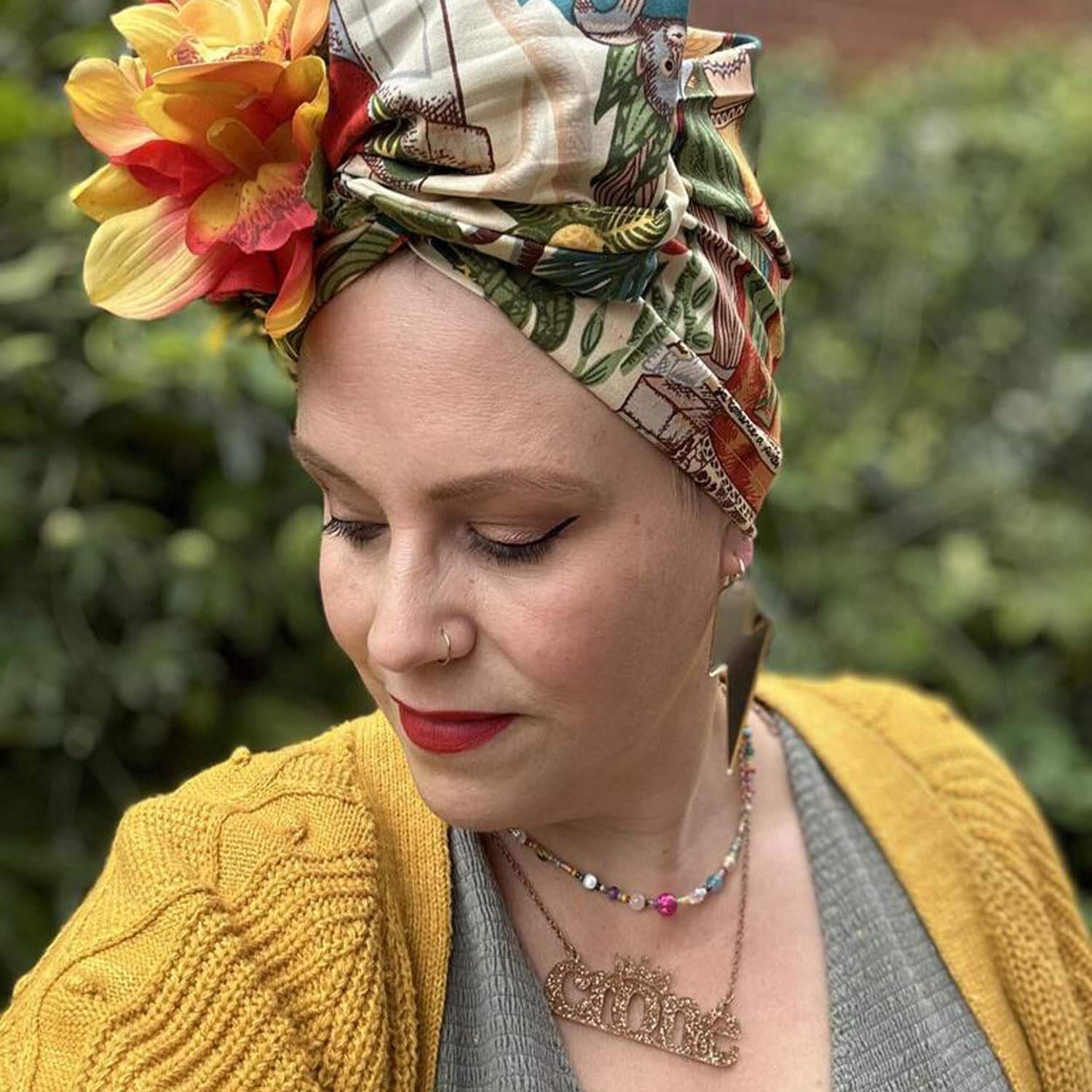 Amy wears Massive Mix & Match Lightning Bolt earrings and a gold glitter Crone necklace from Wear and Resist. 